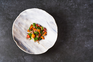 Vegetarian vegetable salad with fresh fish fillet.