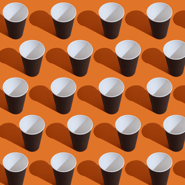 Seamless pattern of black paper coffee cup on colorful background.