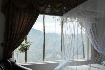Hotel interior with large panoramic window and view of Mount