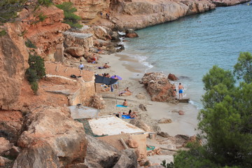 summer vacation by the sea between the beaches and the wild coves of the Ibizan nature in cala...