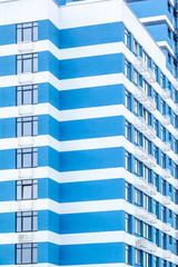 fragment of a building of blue and white stripes