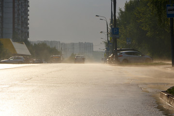Evaporation of water from the asphalt in the city after the rain in summer.