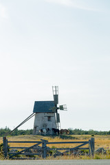 Windmill in Field with Horses