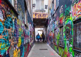 Art colorful graffiti alley in Gent Belgium on a cold cloudy Europe winter day