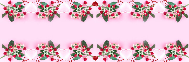 Berries and hearts on a pink background. Large-format banner for Valentine's Day. Concept of love. Happy Valentine's Day. Top view, mirror layout