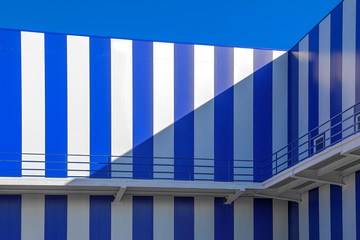 fragment of a building of blue and white stripes