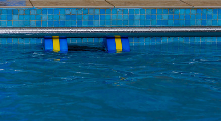 Accessories for swimming training. Dumbbells for swimming. Teaching children to swim..