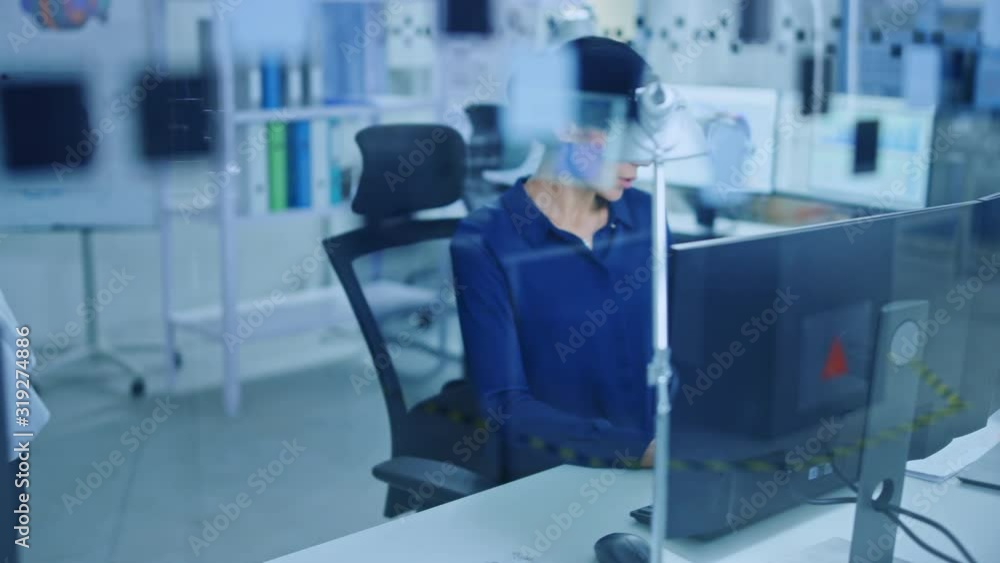 Aufkleber diverse team of industrial engineers working on computers in glass office. supervisor consults with 