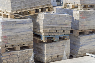 Tile blocks on pallets lie next to each other