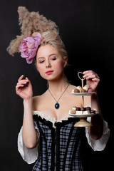 Beautiful blonde countess with chocolate candies