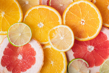 Fresh juicy citrus fruit background. Helathy fresh raw food, lemonade indgredients: orange, lime,...