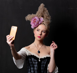 Beautiful blonde countess with mobile phone