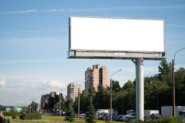 big billboard standing in the city. white advertising field for advertising. Mockup billboard - obrazy, fototapety, plakaty