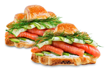 Smoked salmon ricotta cheese cucumber avocado croissant on a white isolated background