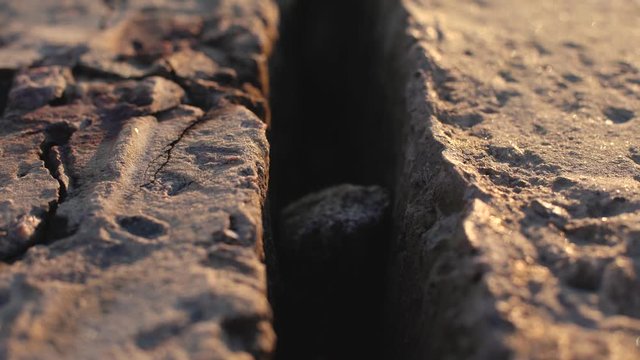 Abstract dolly shot of stone concrete slabs on the beach