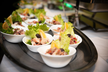 sea salad in small cups on table 