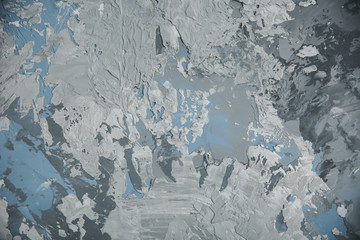texture of smears of white, blue and gray putty