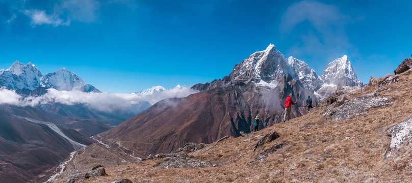 Panoramic view of backpackers facing to Tabuche Peak from the way to Nangkar Tshang View Point, Dingboche, Sagarmatha national park, Everest Base Camp 3 Passes Trek, Nepal