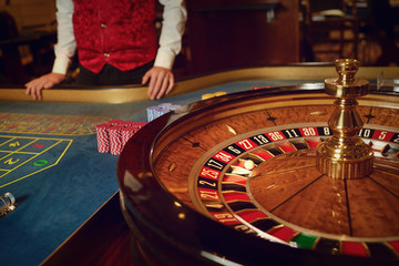 Gambling roulette wheel in a casino.