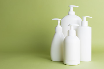 White plastic soap dispensers. Copy space. Place for text.