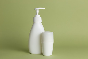 White plastic soap dispensers and deodorant. Copy space. Place for text.