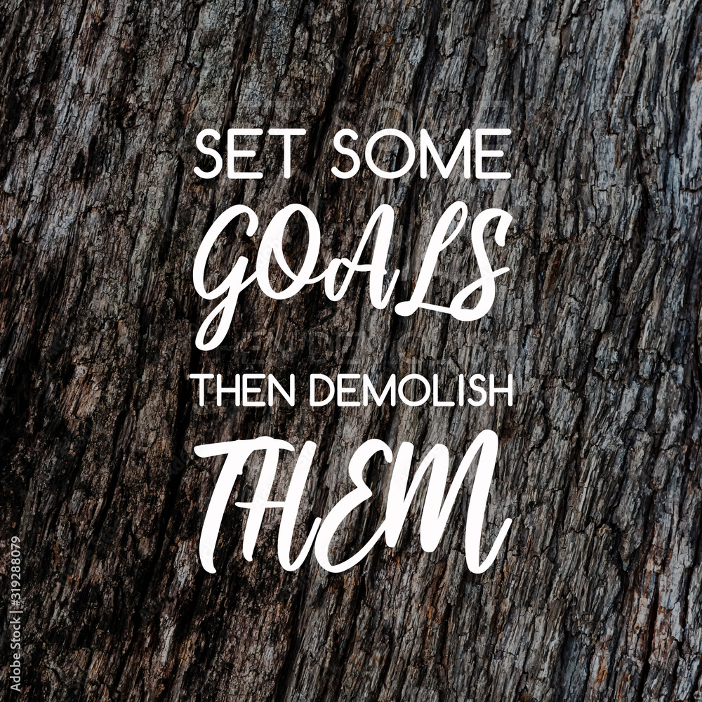 Wall mural motivation and inspirational quotes - set some goals the demolish them. blurry background.