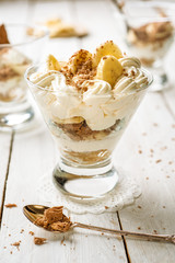 elegant Banoffee pie served in glass cups 