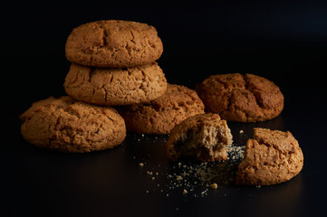 oatmeal cookies on a black background close-up