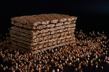 buckwheat crispbread on a table close-up on a black background