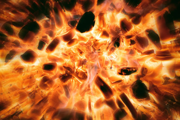 Fire blast. Hot burning coal close up abstract background.