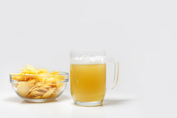 bowl of potato chips or crisps and a glass of wheat beer