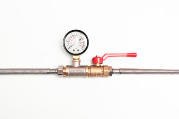 Pressure meter and water valve on a pipeline unit isolated on white background.