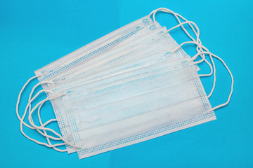 Medical face masks on a blue background