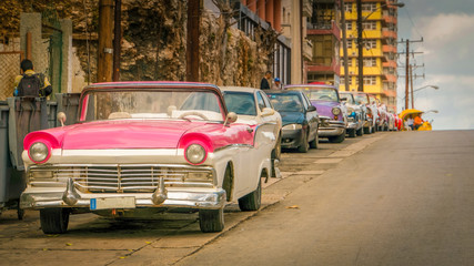 colorful cuban classic cars on a street in havana, cuba