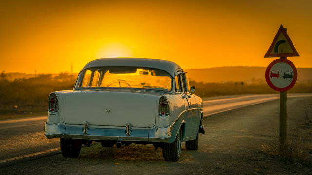 colorful baby-blue cuban classic car in sunset light, cuba