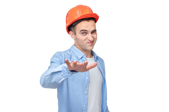 Builder in a helmet shows the so-so gesture, isolated background, toned