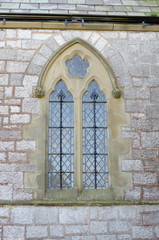 Fototapeta na wymiar An arched church window.