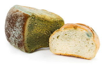 Mouldy bread on a white background. Expired pastries