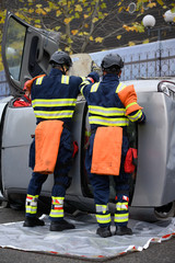 Rescue intervention team trying to save a victim from a car accident