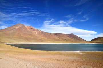 Fototapeta na wymiar The Miniques lake with Cerro Miscanti volcano in the Backdrop at the highland of northern Chile