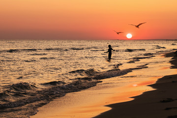 Evening calm sea with a beautiful summer sunset