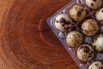 Quail eggs tray, top view. Small raw eggs. Buy healthy food.Quail eggs are more nutritious and healthier than chicken eggs,contain 13% protein.healthy food concept