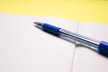 school notebook with pen on background