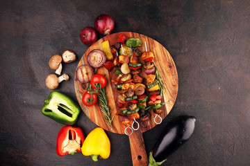 Grilled pork shish or kebab on skewers with vegetables . Food background shashlik