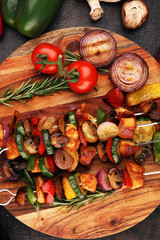 Grilled pork shish or kebab on skewers with vegetables . Food background shashlik