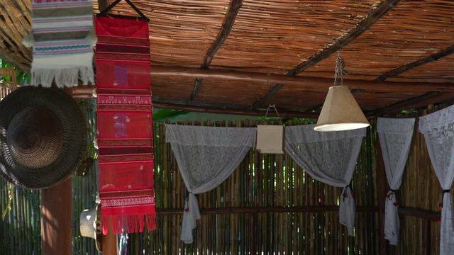Chiang Mai, Thailand with Bamboo house, White mosquito net, White lamp and tung cloth lanna in Thai culture.