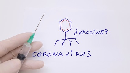 Disposable syringe and label that says: vaccine? coronavirus