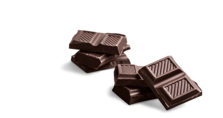 Sweet broken chocolate bar on white background