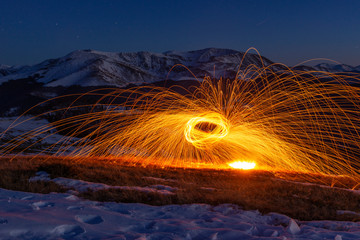 Steel wool photography with mountains in the landscape