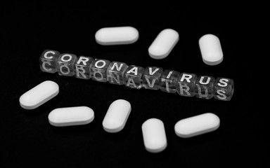 China coronavirus (2019-nCoV) concept with tablets on black dismal background